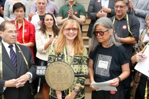 Garment Center Steering Committee supporters speak out on the steps of City Hall.
