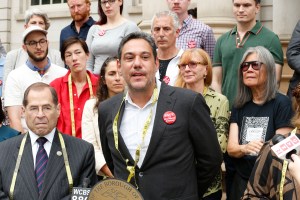 Garment Center Steering Committee supporters speak out on the steps of City Hall.