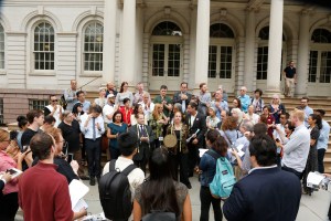 Garment Center Steering Committee supporters speak out on the steps of City Hall.