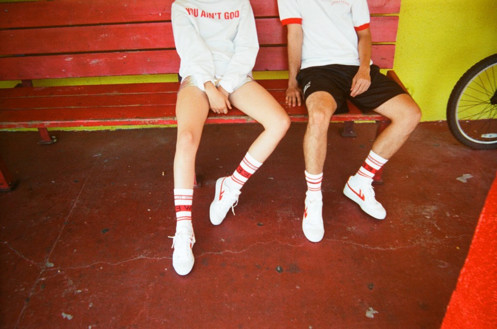 The initial launch includes two sneaker models in blue and red.
