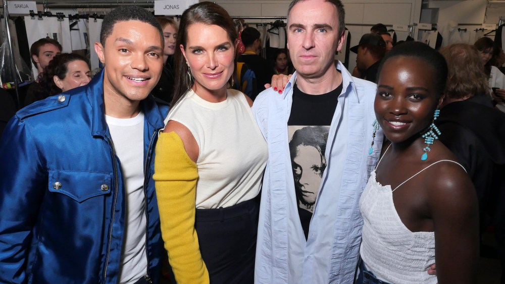 Trevor Noah, Brooke Shields, Raf Simons and Lupita Nyong'o in the Front Row at Calvin Klein 205W39NYC RTW Spring 2018