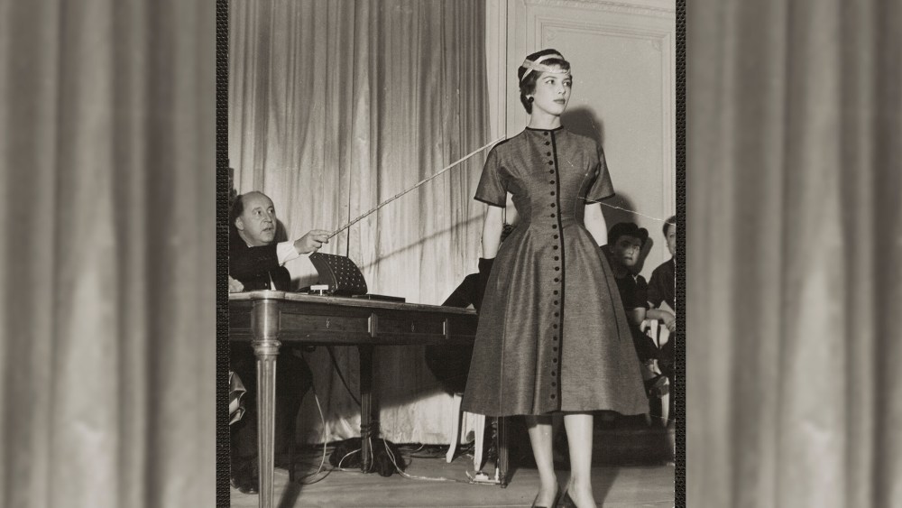 Christian Dior and model Victoire, 1953. She wears Victorine dress, Autumn-Winter 1953 Haute Couture collection, Vivante line.