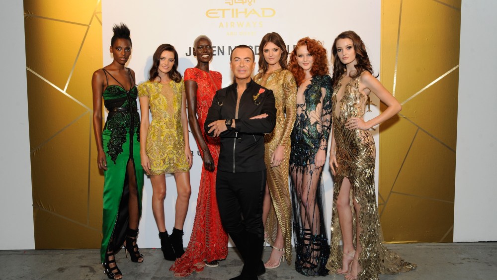 NEW YORK, NY - SEPTEMBER 07:  Vice President of Sponsorships Etihad Airways Patrick Pierce, Fashion designer Julien Macdonald (C) and models attend Etihad Airways Celebrating Runway To Runway With Special Guest Julien MacDonald Obe at Skylight Clarkson Sq on September 7, 2017 in New York City.  (Photo by Rabbani and Solimene Photography/Getty Images for IMG Fashion)