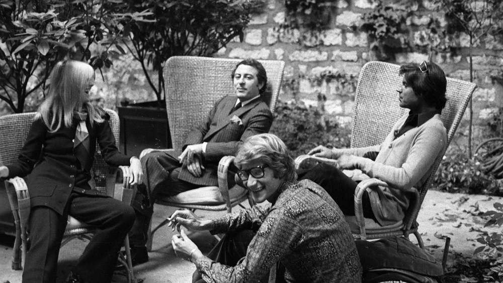 Designer Yves Saint Laurent with partner Pierre Bergé, Betty Catroux and her husband Francois Catroux in the graden of Yves Saint Laurent's Paris home.