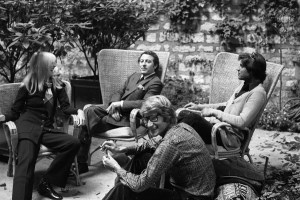 Designer Yves Saint Laurent with partner Pierre Bergé, Betty Catroux and her husband Francois Catroux in the graden of Yves Saint Laurent's Paris home.