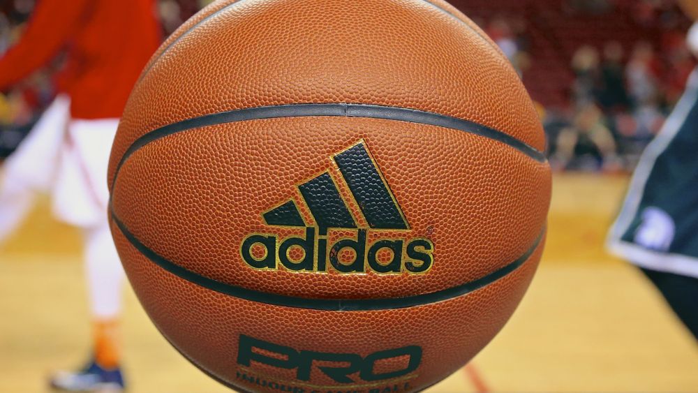 Photo, an Adidas game ball rests on the scorer's table prior to an NCAA college basketball game between Michigan State and Nebraska in Lincoln, Neb. Unlike the NBA, which uses the Spalding ball for all games, the NCAA has no uniform brand for regular-season games. That means a team could be playing with a type of ball it's unaccustomed to when it goes on the roadGame Balls Galore Basketball, Lincoln, USA
