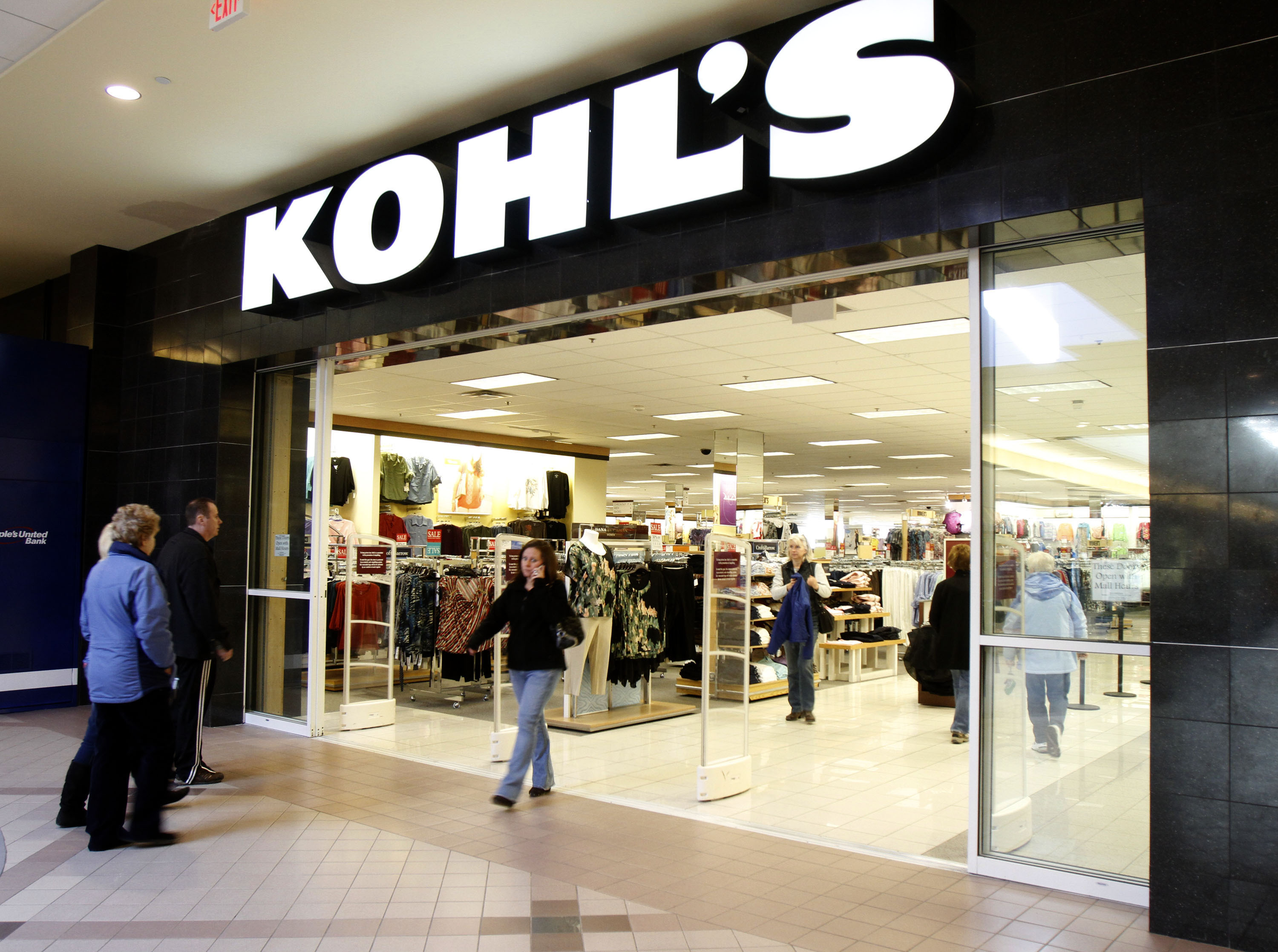 Shoppers enter the Kohl's store in South Burlington, Vt., on . Kohl's Corp.'s fourth-quarter net income increased 14 percent as merchandise profit margins improved through exclusive brand offerings and tight inventory managementEarns Kohls, South Burlington, USA