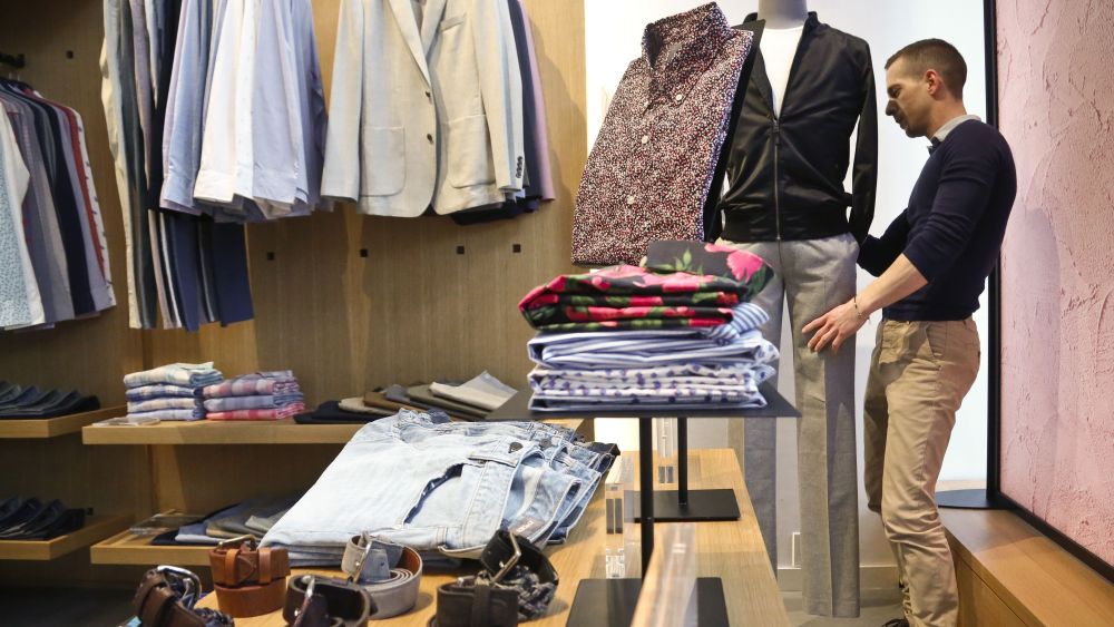 Bonobos manager Stephen Lusardi arranges clothing at the brand's Guideshop, in New York's Financial District. More shoppers are looking to social media or curated selections for fashion inspiration. That adds to the woes of mall-based stores, as people are already buying fewer clothes, spending online or at discounters when they do, and demanding more personal and convenient ways to buyShopping for Clothes, New York, USA - 20 Mar 2017