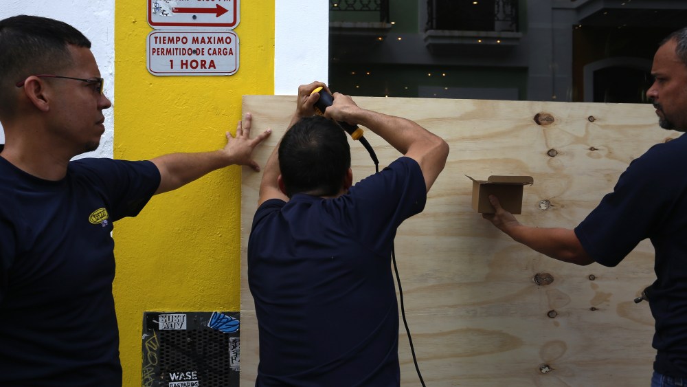 Men cover the entrance of a room with wooden boards in San Juan, Puerto Rico, 5 September 2017. Puerto Rico is taking measures ahead of the passage of Hurricane Irma, which is on the verge of impacting the Caribbean Lesser Antilles as it reached the maximum level of category 5.Puerto Rico takes measures ahead of Irma's Hurricane passsage, San Juan - 05 Sep 2017