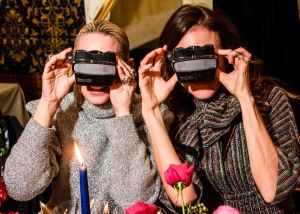 Jennifer Fisher and Alison Loehnis using viewfinders.
