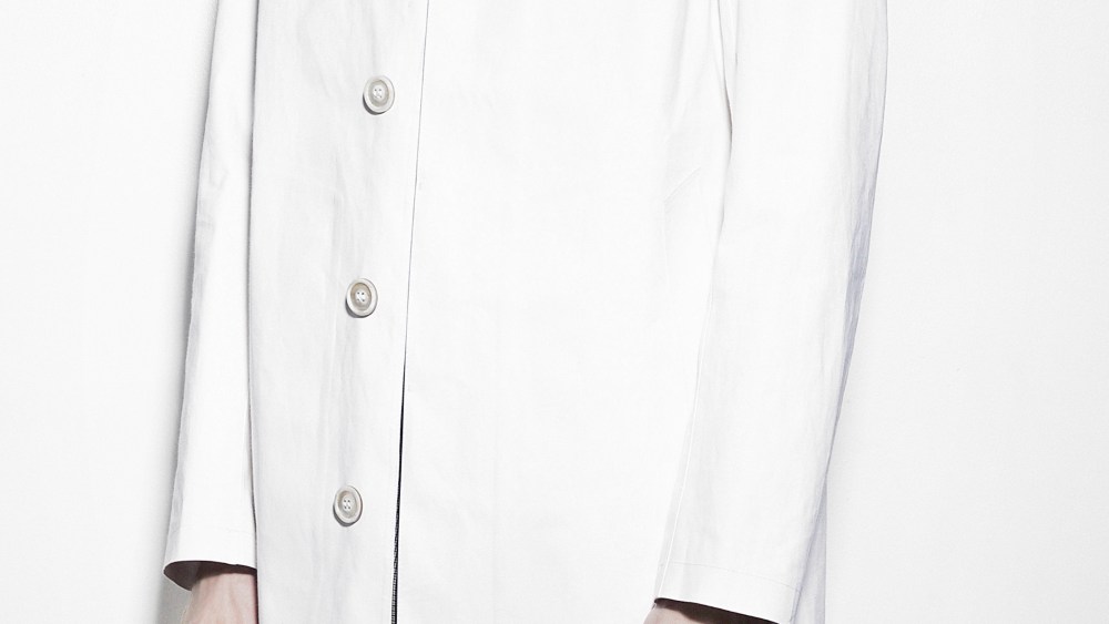 A white trench coat from Maison Margiela's collaboration with Mackintosh.