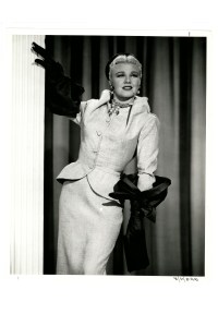 A snake chain necklace suspending simulated pearl and diamond foliate centerpiece with tremblers. Hook and eye closure.  Pictured on Ginger Rogers in "Dream Boat" (20th Century Fox, 1952).