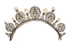A silver-plated bandeau in antique finish, with simulated diamonds and pearls.   Worn by Bette Davis in "The Private Lives of Elizabeth and Essex" (Warner Bros. 1939); and Barbara Britton in a studio publicity portrait used to promote "The Return of Monte Cristo" (Columbia, 1946).