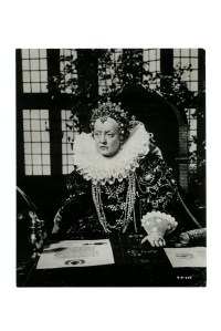 A silver-plated bandeau in antique finish, with simulated diamonds and pearls.   Worn by Bette Davis in "The Private Lives of Elizabeth and Essex" (Warner Bros. 1939); and Barbara Britton in a studio publicity portrait used to promote "The Return of Monte Cristo" (Columbia, 1946). The bandeau pictured on Davis.