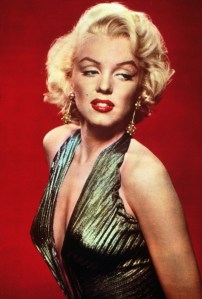 A pair of gold plated clip on earrings featuring filigree spheres accented with simulated diamonds, back of clips stamped "sterling patented."  Pictured worn by Marilyn Monroe in a series of Fox publicity photos to promote the film "Gentlemen Prefer Blondes" (20th Century Fox, 1953).