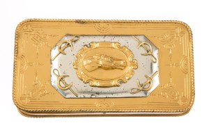 A gold and silver plated cigar box with a horse head relief on the lid, lined on the inside with cigar holders.Used by Clark Gable in "Gone with the Wind" (Selznick International Pictures, 1939).