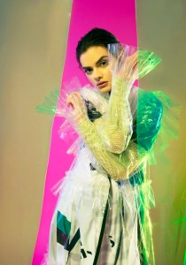 Koché’s cotton dress over Jeremy Scott’s Swarovski-encrusted fishnet mesh top; Dilara Findikoglu’s PVC raincoat.