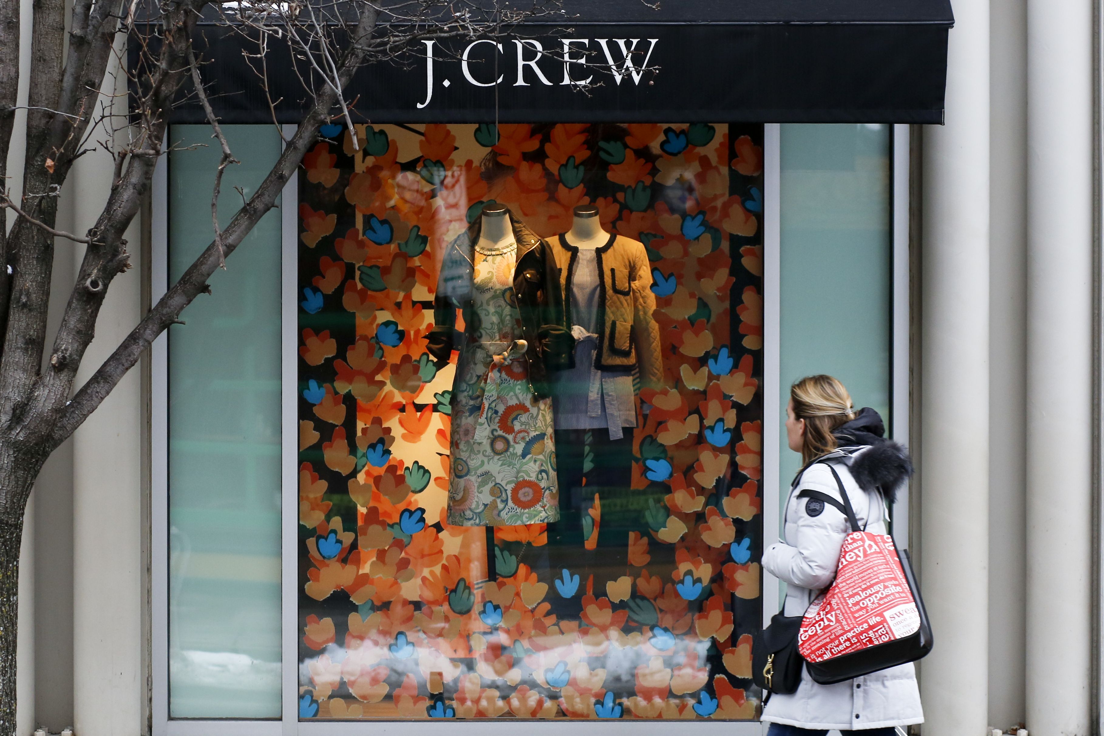 Hold for Swayne Hall Business Photo-A shopper passes the display in the window of a J.Crew store in the Shadyside shopping district of PittsburghConsumer Spending, Pittsburgh, USA - 10 Feb 2017