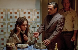Mammoliti (Marco Leonardi, center) hangs up J. Paul Getty III's (Charlie Plummer, left) attempt to call his mother in TriStar Pictures' ALL THE MONEY IN THE WORLD.