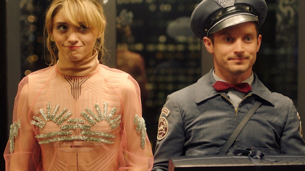 Natalia Dyer and Elijah Wood in Prada's "The Postman Dreams 2" short movies series.