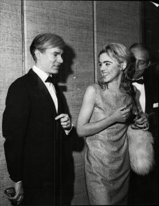 Andy Warhol Artist And Edie Sedgwick Actress At Vidal Sassoon's New York Launch Party 1965. Andy Warhol Artist And Edie Sedgwick Actress At Vidal Sassoon's New York Launch Party 1965.