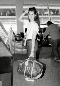Actress and model Brooke Shields holds on to her luggage while waiting for a plane at John F. Kennedy airport in New York on . Miss Shields was en route to Nairobi, Kenya via London to tape a television special while on a safariBrooke Shields, New York, USA
