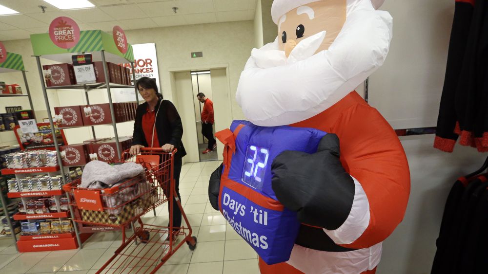 A shopper rolls a full cart past a Santa figure with a countdown clock numbering the days until Christmas at a J.C. Penney store, in Seattle. Black Friday has morphed from a single day when people got up early to score doorbusters into a whole season of deals, so shoppers may feel less need to be outHoliday Shopping Black Friday, Seattle, USA - 24 Nov 2017
