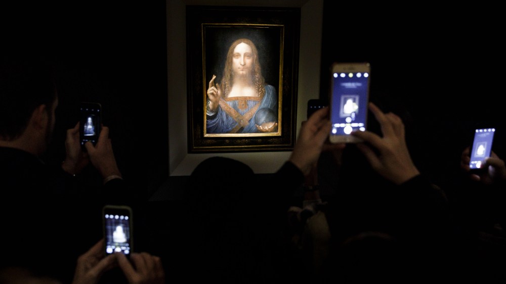 YEARENDER 2017 NOVEMBER People take pictures of the painting 'Salvator Mundi' by Leonardo da Vinci (circa 1500) during a public preview before an auctioning of the painting tonight at Christie's auction house in New York, New York, USA, 15 November 2017. The painting is reportedly one of only twenty paintings by Da Vinci and was sold for 450 million USD.Auction Preview of Leonardo da Vinci Painting Salvator Mundi, New York, USA - 15 Nov 2017