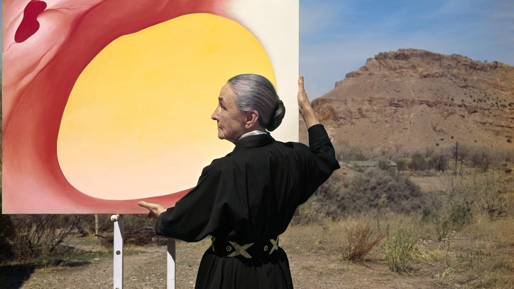 Tony Vaccaro, Georgia O'Keefe with "Pelvis Series, Red with Yellow" and the desert, 1960. Georgia O'Keeffe Museum. Courtesy of Tony Vaccaro studio.