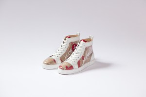 For fall, Christian Louboutin reprised a craft technique derived from a 1999 archive mule called Trash. Hand-torn pieces of the label’s brown paper bags are collaged beneath a PVC overlay and employed for studded baseball boots, heeled Chelsea styles and a creeper.  Elsewhere there was an interiors-inspired story with patchwork applications and optic prints. Velvet slippers spelled out the word love in mismatched beading while a graffiti print came rendered in sequins on sneakers.