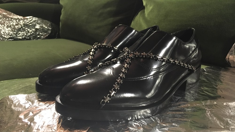 Diego Vanassibara gave his bondage signature a lighter touch for fall. The designer drew inspiration from the world of jewelry; lug-sole brogues came overlaid with harnesses or bracelet buckles done in gunmetal grey. ÒJust enough aggression without being over the top,Ó he reasoned. Elsewhere, lace-ups in pleated satin came overlaid with hand-shredded pieces of the same fabric offering a more contemporary touch.