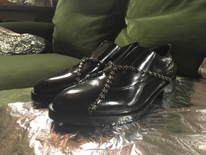 Diego Vanassibara gave his bondage signature a lighter touch for fall. The designer drew inspiration from the world of jewelry; lug-sole brogues came overlaid with harnesses or bracelet buckles done in gunmetal grey. ÒJust enough aggression without being over the top,Ó he reasoned. Elsewhere, lace-ups in pleated satin came overlaid with hand-shredded pieces of the same fabric offering a more contemporary touch.