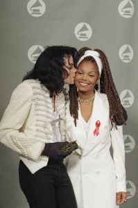 Michael Jackson, Janet Jackson Michael Jackson, holding his Grammy Legend award, gives his sister Janet Jackson a kiss backstage at the 35th annual Grammy Awards on in Los AngelesMichael Jackson, Los Angeles, USA