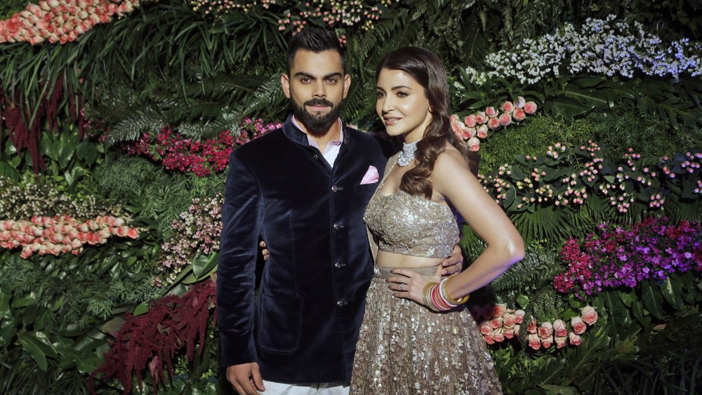 Indian cricketer Virat Kohli, left, and Bollywood actress Anushka Sharma, pose for the photographers during their wedding reception in Mumbai, India, . The couple got married at a heritage resort in the Italian countryside of Tuscany on Dec.11Bollywood, Mumbai, India - 26 Dec 2017