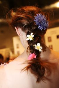 ÒThe inspiration actually was quite fresh and young girls,Ó said hairstylist Damien Boissinot backstage at Viktor & Rolf. Here, models with long hair were given a low, slightly messy braid, and wispy strands were left to waft. ÒItÕs more like an idea of movement, like wind blowing,Ó he explained. Then, for a feminine, touch flowers were added to the braids and headpieces with large flowers topped off the look of some. Ñ Jennifer Weil