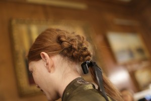 "The painter John Constable was one of the starting points for the inspiration," said hairstylist James Pecis, working with KMS Hair products. "It was more about the color scheme in his paintings and also his portraits of women. There is a lot of tailoring in this collection, so they wanted to bring a tomboy feeling." Models' hair was given a side part on the right side, then blow-dried, pulled back and tied into knots. Hair was divided into three separate sections in zigzag manner - all the way around to the back  - and topped off with a bow.  Ñ Lorelei Marfil