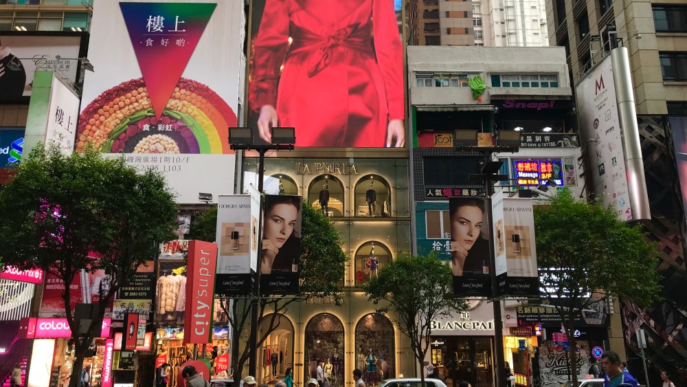 The La Perla store (center) on Russell Street, Causeway Bay. The flagship was built with a large LED screen on top.