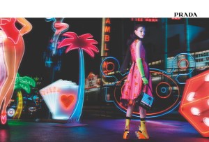 Prada tapped model Amanda Murphy to front its women’s wear advertising campaign for fall, dubbed “Neon Dream.” Photographed by Willy Vanderperre, Murphy appears solo in the color images, immersed in neon signs representing Las Vegas’ nightlife. Sporting the collection’s key, neon pieces styled with the bold, flame wedge sandals and contrasting socks, the model herself becomes a luminous representation of Prada. Reflecting the main theme that inspired the collection, Murphy stands out in the images with her strong attitude, embodying a woman in the dark night, in control and unafraid. — Sandra Salibian