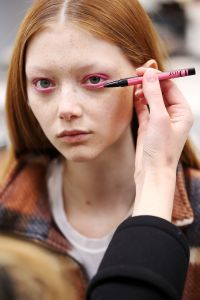 Peter Philips, creative and image director of Christian Dior makeup, received an e-mail with some 20 images of sunglasses that the houseÕs artistic director Maria Grazia Chiuri, was thinking of sending down the runway during the fall display. ÒCould this inspire you for the show?Ó he was asked. Yes was the answer, and Philips used the glassesÕ colors as cues for different hues of eyeliner. ÒLetÕs play color matching,Ó thought the makeup artist, turning to the Diorshow On Stage Liners, out in May.  Yellow glasses were paired with yellow eyeliner and blue with blue, for instance. Because the models were to seem like part of a demonstration (think student uprisings in France during May 1968), the idea was not to create makeup that seemed too pretty, Philips explained. ÒI could make makeup which is cool,Ó he said. ÒBut not precious.Ó He drew liner on modelsÕ top and bottom lids, but it didnÕt reach either corner of their peepers. ÒThat kind of opens up the eye, but at the same time gives a bit of a conceptual aspect to it,Ó said Philips, adding it lends a strength to the look, too. ÒWe went for beautiful skin, but no contouring, no blush, no highlights.Ó He curled modelsÕ lashes and gently enhanced their eyebrows. Some key products used included Dior Capture Youth Glow Booster Age-Delay Illuminating Serum, Diorskin Forever Undercover Foundation and Dior Addict Lip Maximizer.  Ñ Jennifer Weil
