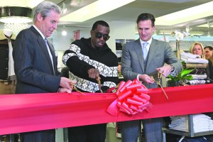 Then-Macy's chairman and chief executive officer Terry J. Lundgren, Combs and president Jeff Gennette at a ribbon-cutting in 2011.