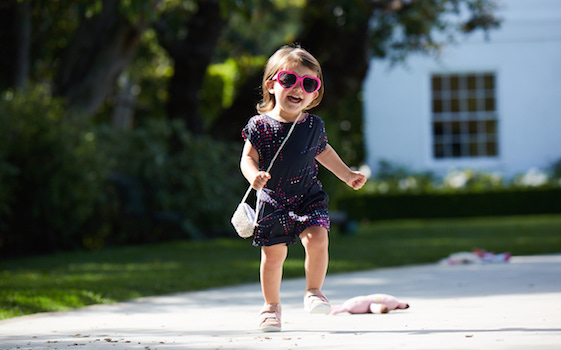 Little girl running in Stride Rite