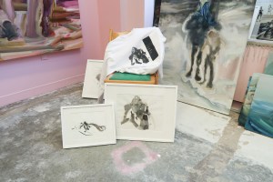 Prints by artist Kylie Manning beside a sweatshirt with their imprint at the Spring/Break Art Show.