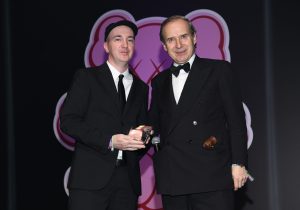 HONG KONG, HONG KONG - MARCH 26:  Artist Brian Donnelly (also known as KAWS) (L) and auctioner Simon de Pury attend the amfAR Hong Kong Gala 2018 at Shaw Studios on March 26, 2018 in Hong Kong, Hong Kong. (Photo by Clint Spaulding/amfAR/Getty Images for amfAR)