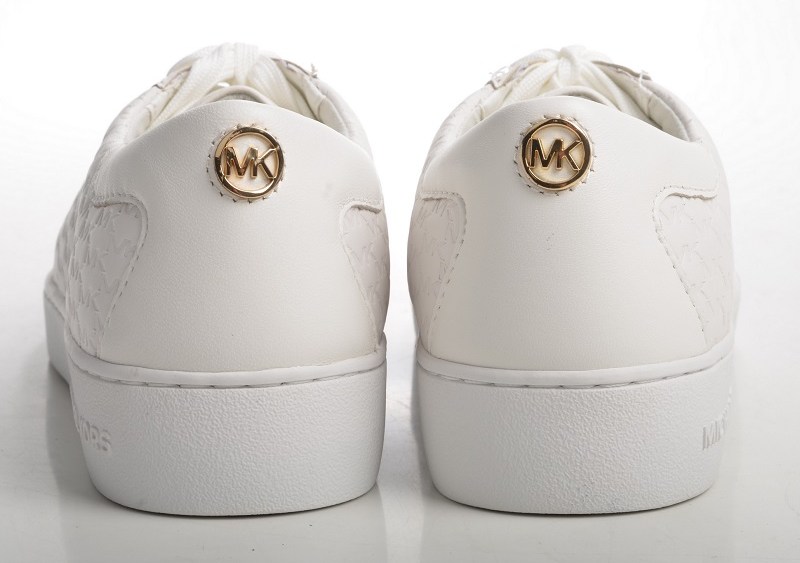 Michael Kors Bites Back, Raises Revenue Forecast