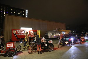 Pedicab drivers wait for party guests outside.