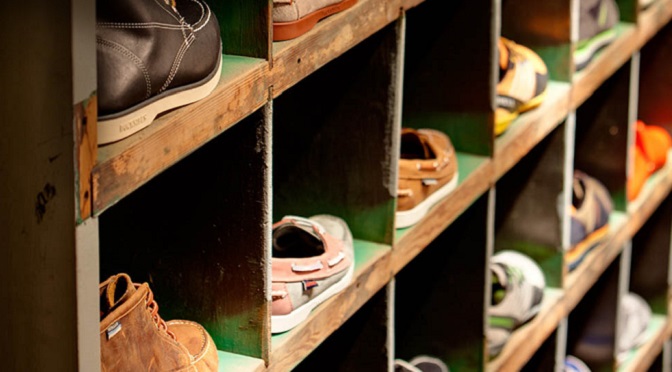 Wolverine Worldwide shoes lined up on a wall