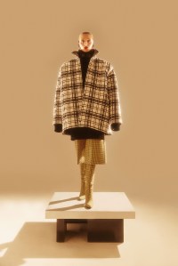Balenciaga’s wool long-sleeve shirt, turtleneck, pants, boots and polyamide hoodie turtleneck.