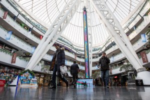 Men and women shop at Khan Shatyr Mall in Astana Kazakhstan.