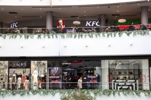 Men and women shop at Khan Shatyr Mall in Astana, Kazakhstan.