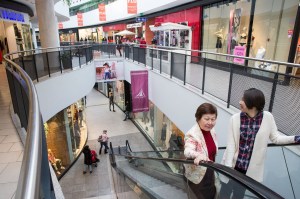 Men and women shop at Khan Shatyr Mall in Astana, Kazakhstan.